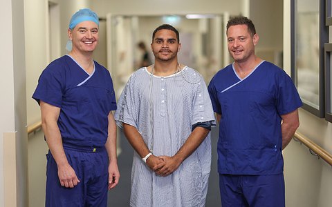 Dr Shane Blackmore, Tye and Professor Rodda at the hospital